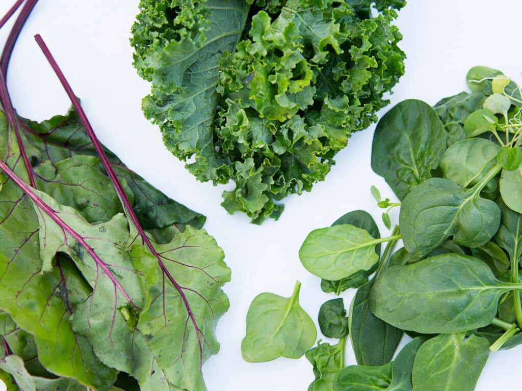 Close-up shots of leafy greens, to highlight their individual benefits.